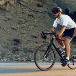 professional cyclist on a mountain road at sunrise 2021 09 03 10 25 03 utc