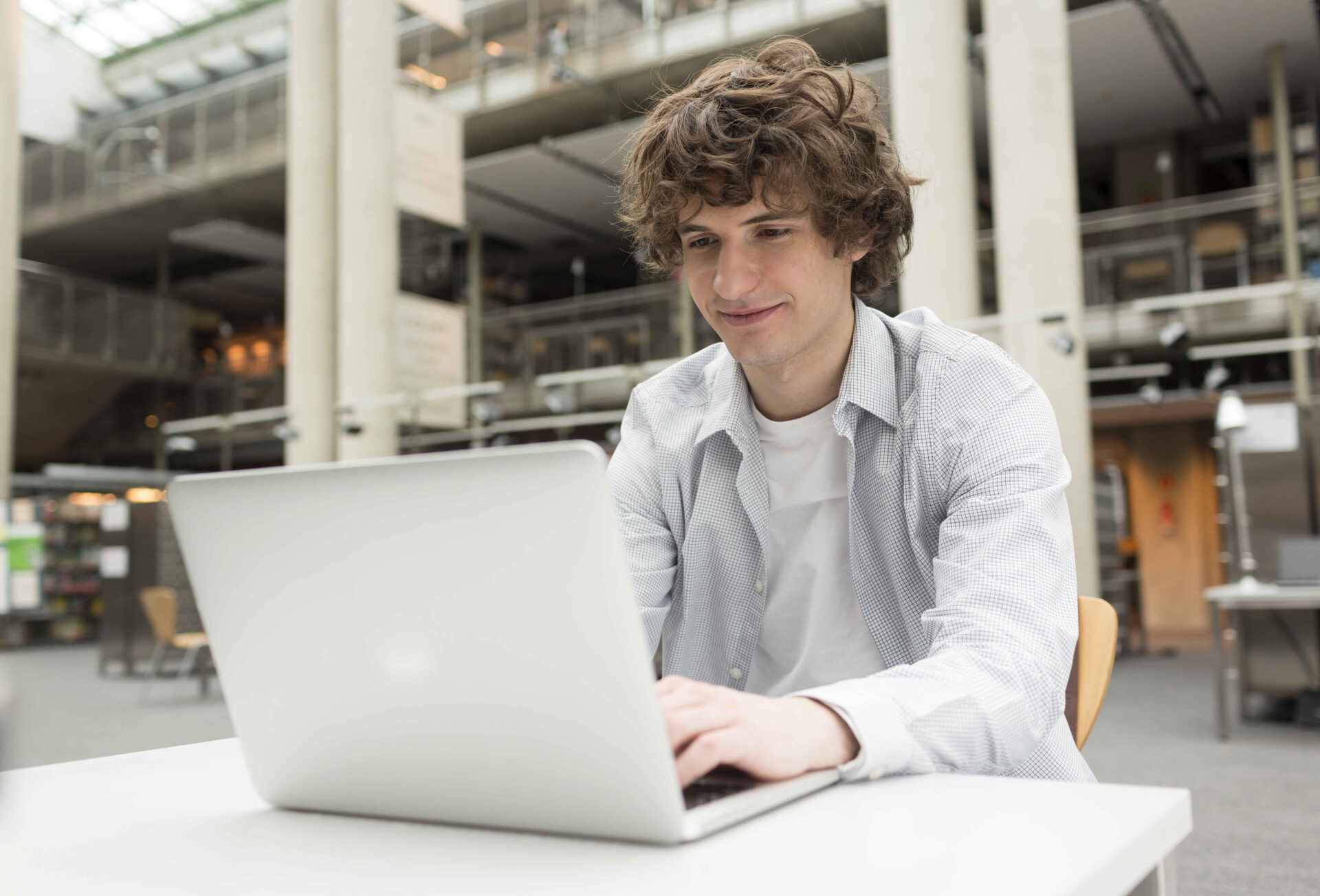 student using laptop in a university library 2022 12 16 22 06 25 utc 2