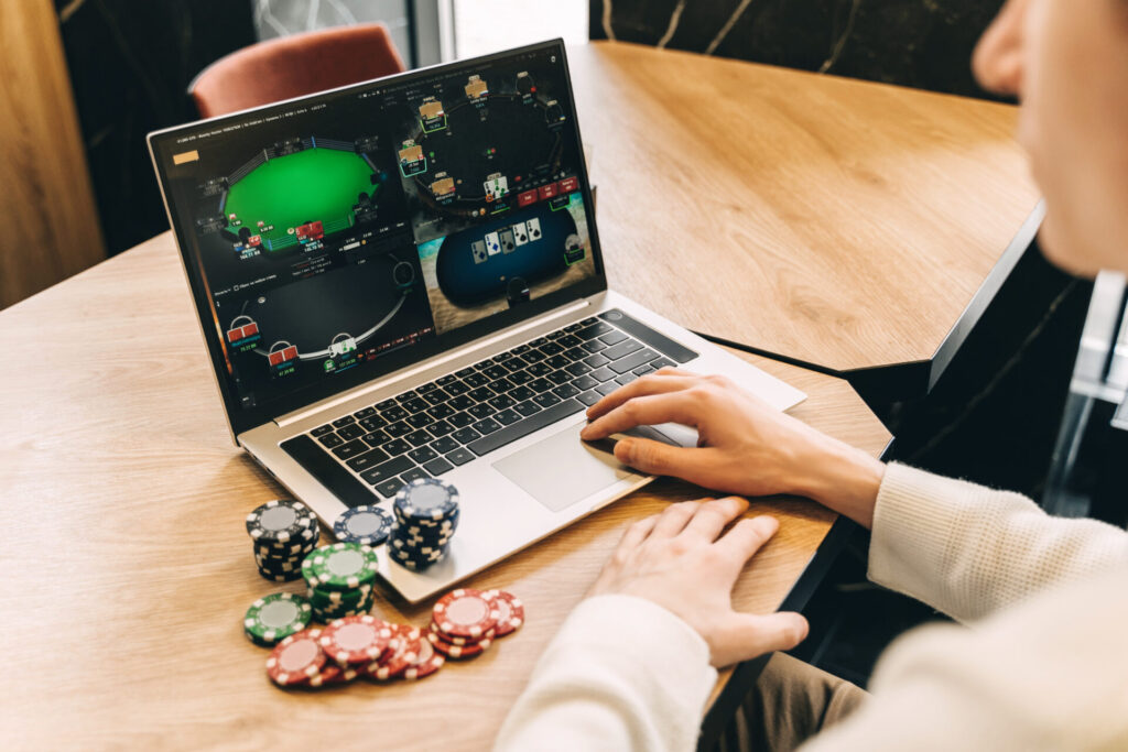 young man play online poker in laptop 2022 07 12 14 36 12 utc