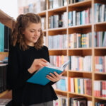 beautiful girl is studying reading a book while st 2021 09 15 18 55 29 utc