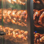 grilled chicken is roasted on a skewer in a large 2022 11 15 05 24 15 utc