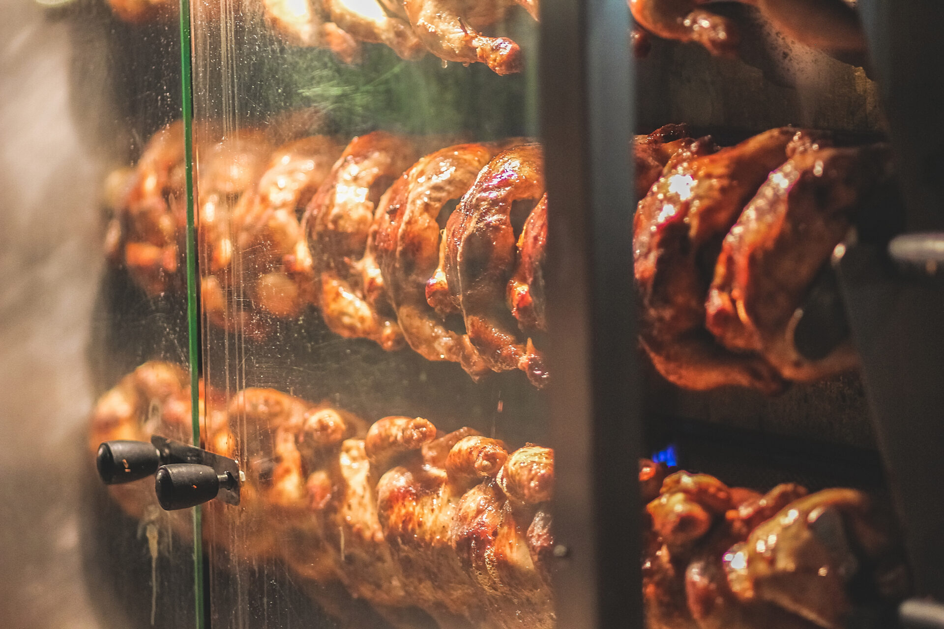 grilled chicken is roasted on a skewer in a large 2022 11 15 05 24 15 utc