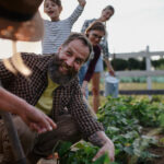 happy farmers or gardeners working outdoors at com 2022 01 19 00 09 48 utc 1
