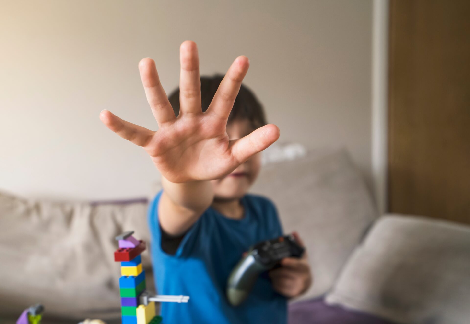 kid showing stop gestures with his hand while hold 2022 11 15 14 05 53 utc