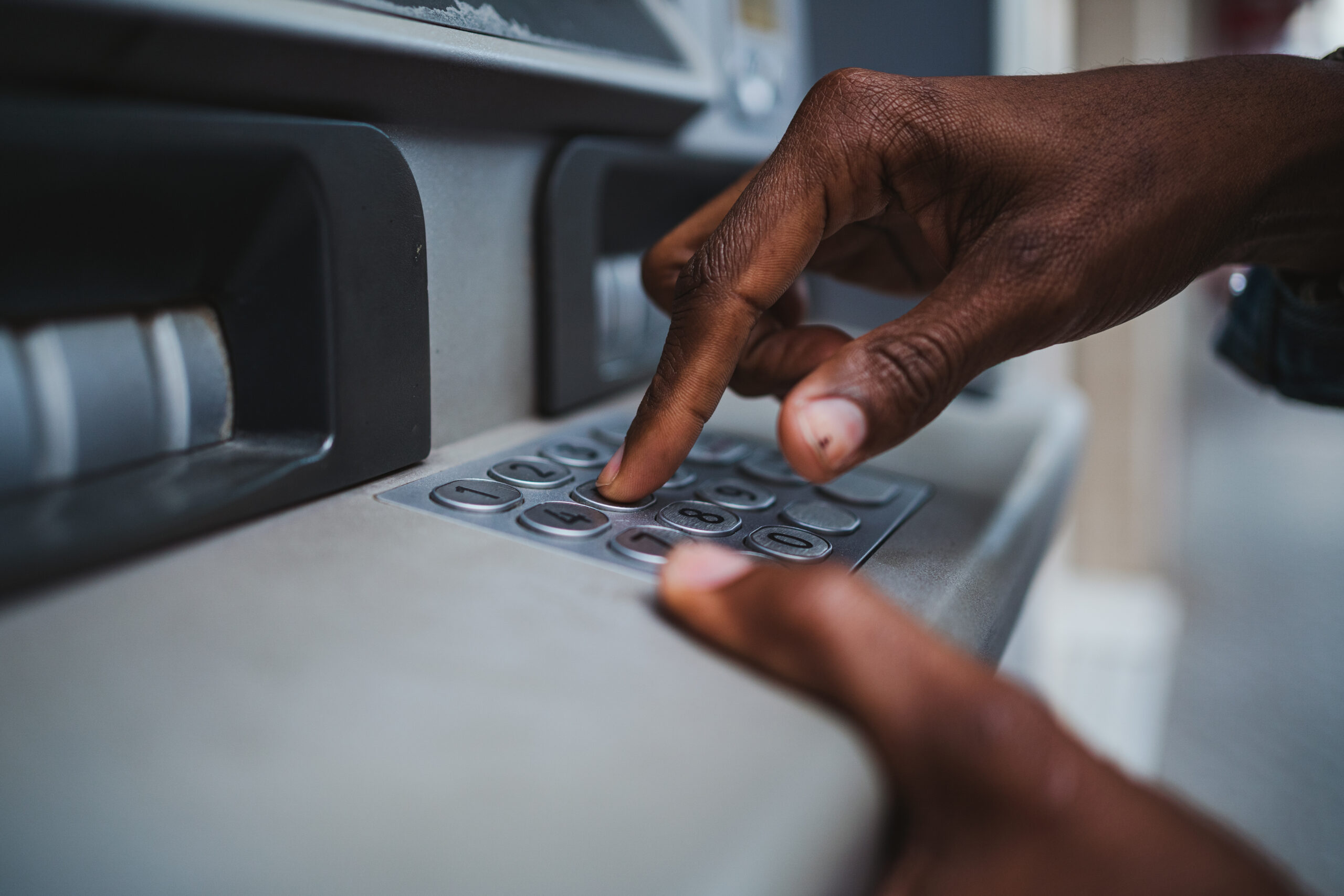 man using a atm to withdrawal money 2023 02 02 04 47 27 utc scaled