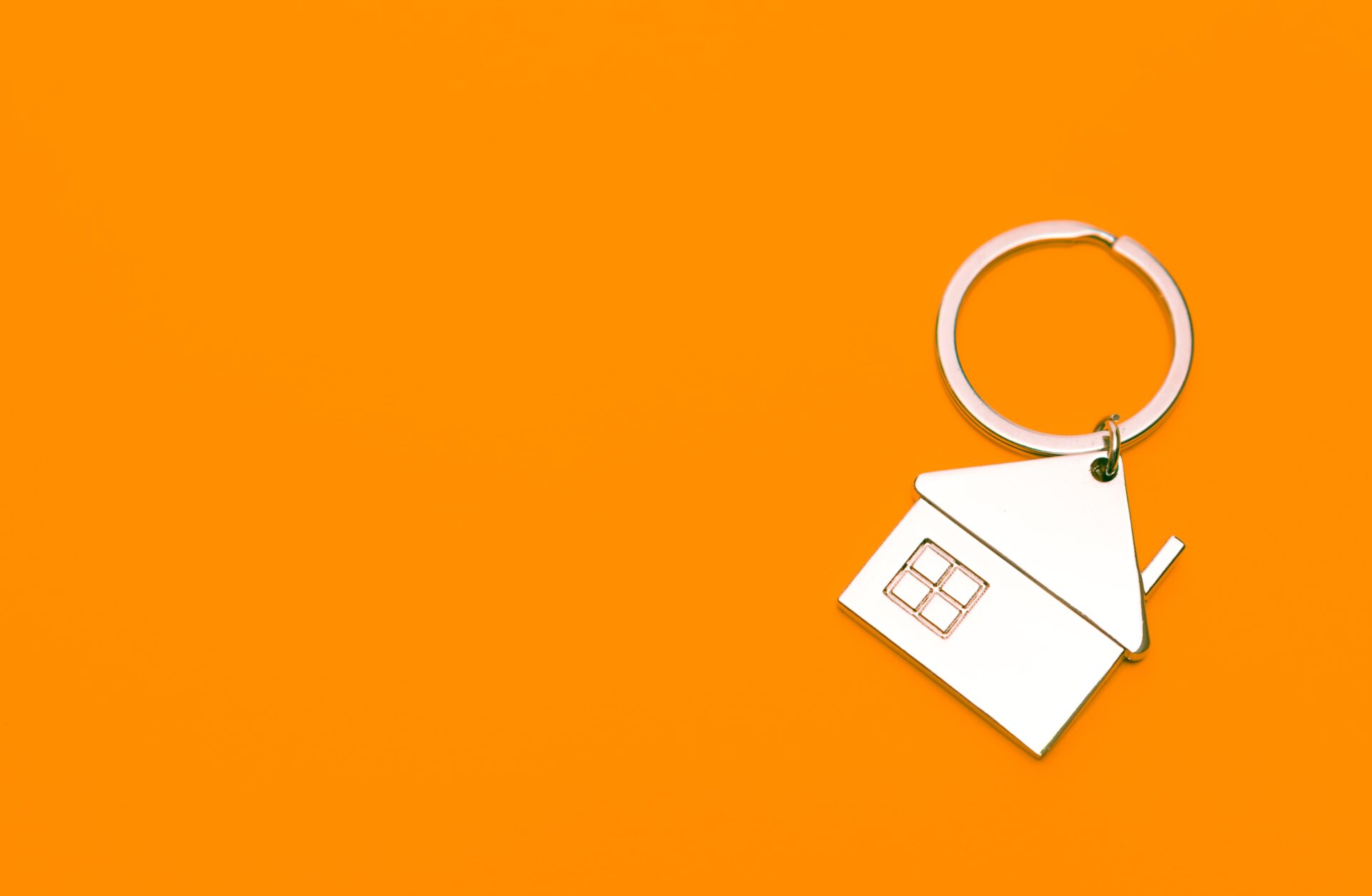 trinket for key concept house on orange backgroun 2022 11 16 16 34 58 utc