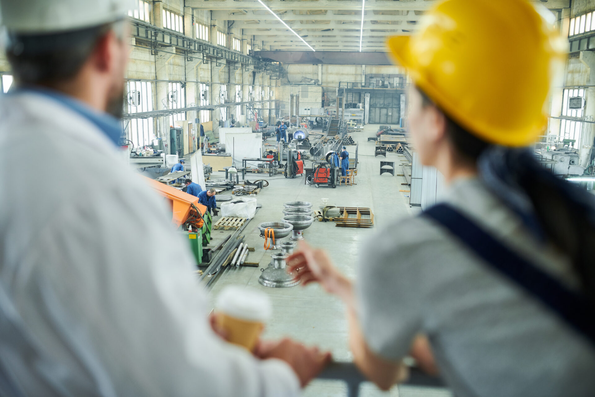 two workers looking at workshop interior 2021 09 24 03 51 44 utc