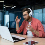 worried young male freelancer programmer in headp 2023 03 03 23 47 36 utc