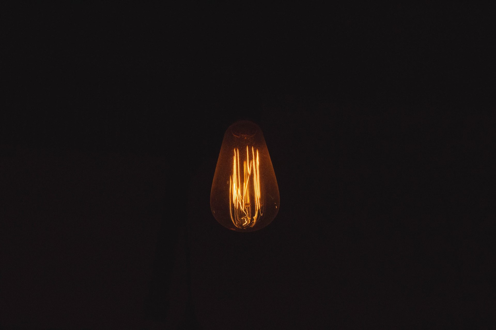 a dim light bulb lit in the dark 2022 12 31 04 55 45 utc
