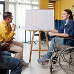 businesswoman with disability pointing at chart 2023 04 06 20 10 10 utc