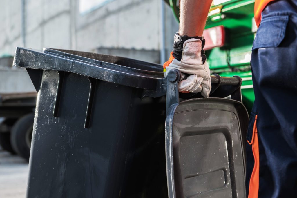 garbage truck worker moving trash can 2022 12 16 11 47 53 utc