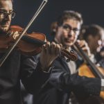 symphonic string orchestra performing on stage 2021 08 26 22 39 59 utc