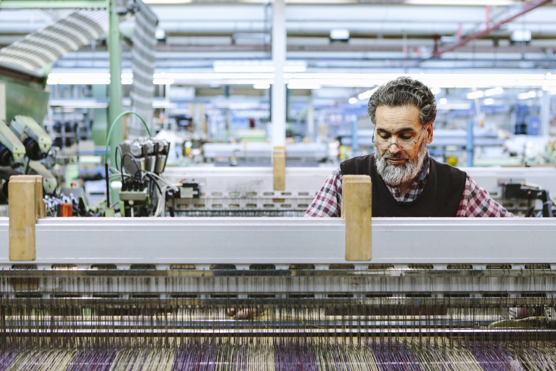 male factory worker on weaving machine in woollen 2022 03 08 00 13 56 utc