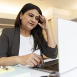 tired indian businesswoman using laptop computer w 2023 05 10 23 36 54 utc