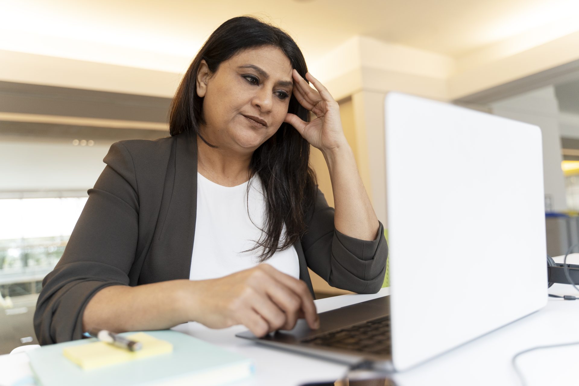 tired indian businesswoman using laptop computer w 2023 05 10 23 36 54 utc