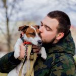 young man with his dog jack russell terrier 2022 01 12 05 09 31 utc