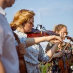 beautiful young woman playing violin in orchestra 2022 01 18 16 08 55 utc