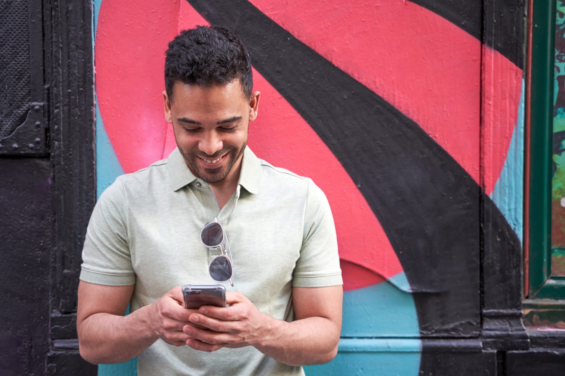 cheerful young latin guy texting chatting on his 2022 11 07 22 50 13 utc