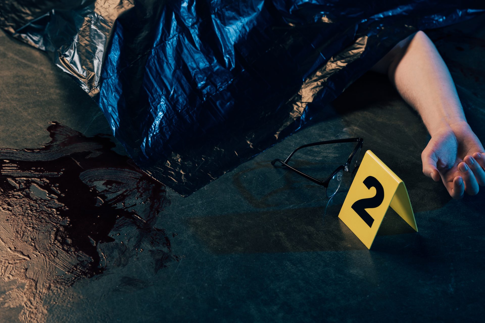 cropped view of covered corpse near glasses and ev 2023 05 03 03 24 26 utc