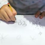 hands of drawing little girl close up 2022 12 16 22 27 11 utc