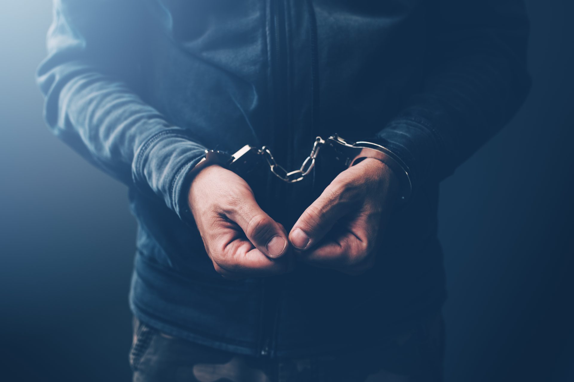 arrested computer hacker with handcuffs 2021 08 26 23 02 58 utc