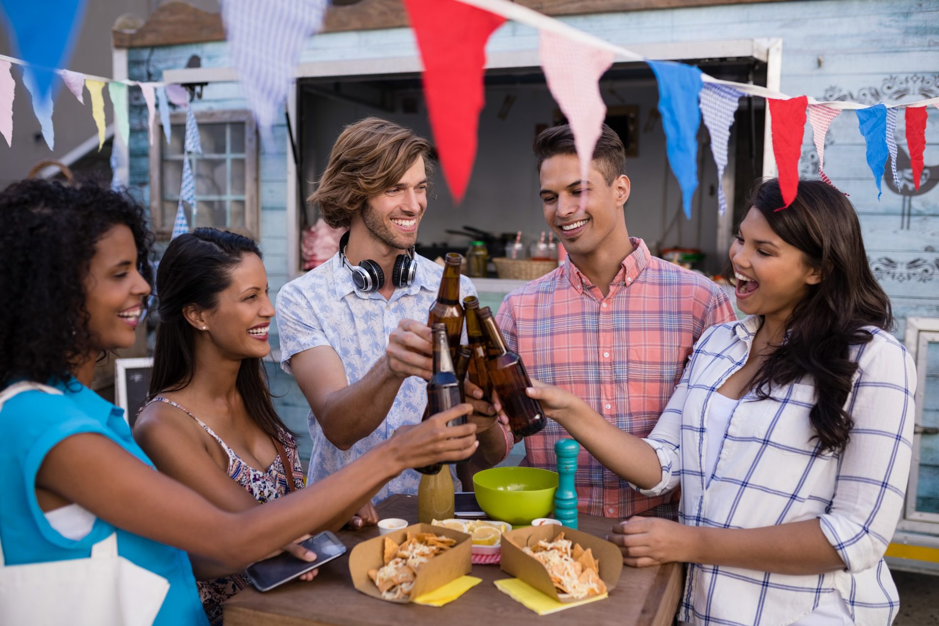 group of friends toasting beer bottles 2021 08 28 17 57 34 utc