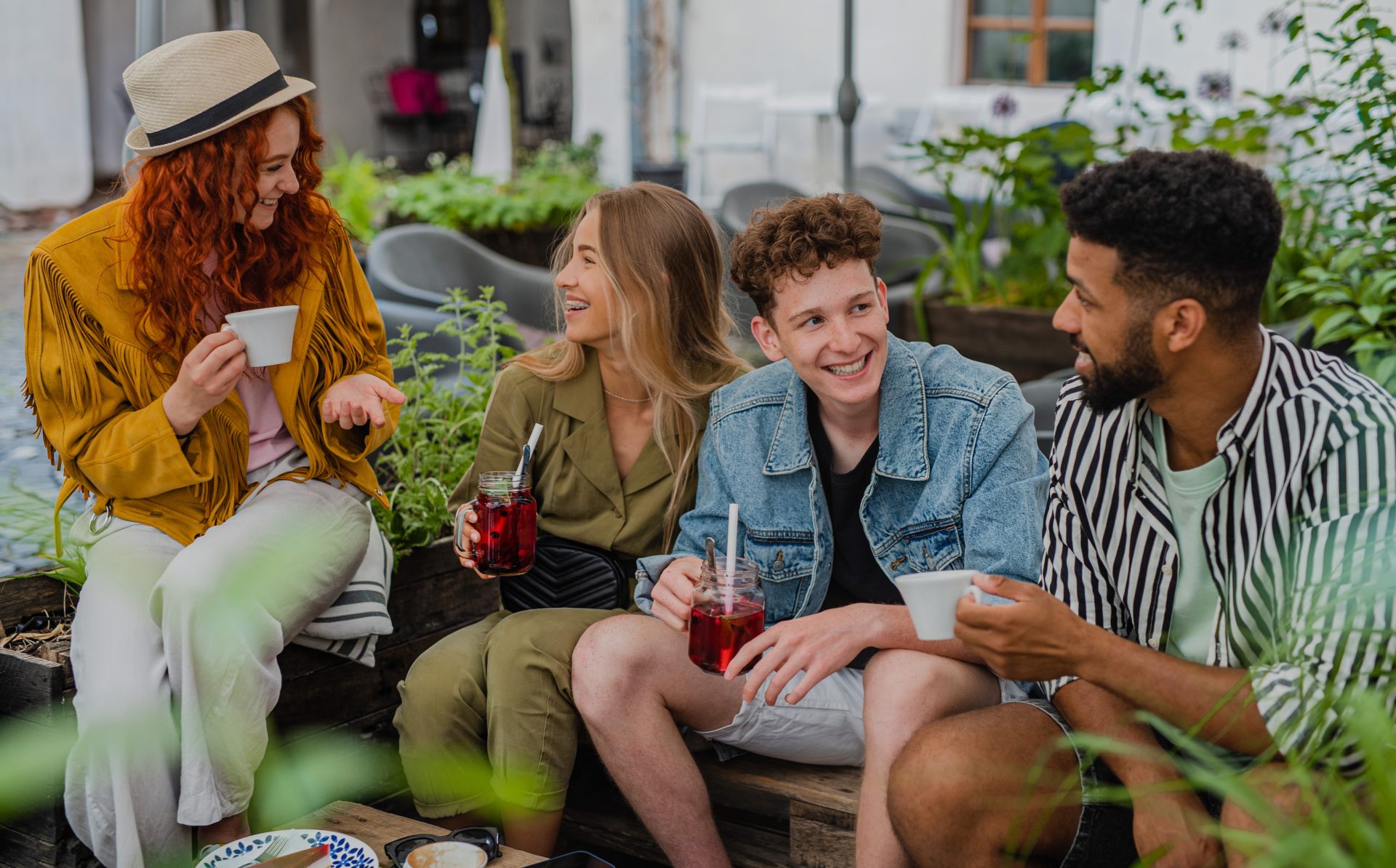 group of happy young people sitting in outdoors ca 2022 01 18 23 39 04 utc