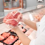 incognito female butcher showing meat behind count 2021 08 28 06 45 12 utc