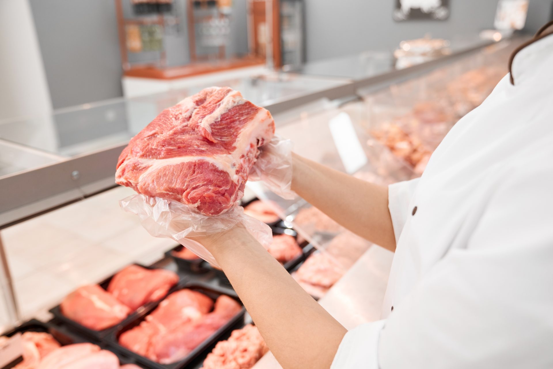incognito female butcher showing meat behind count 2021 08 28 06 45 12 utc