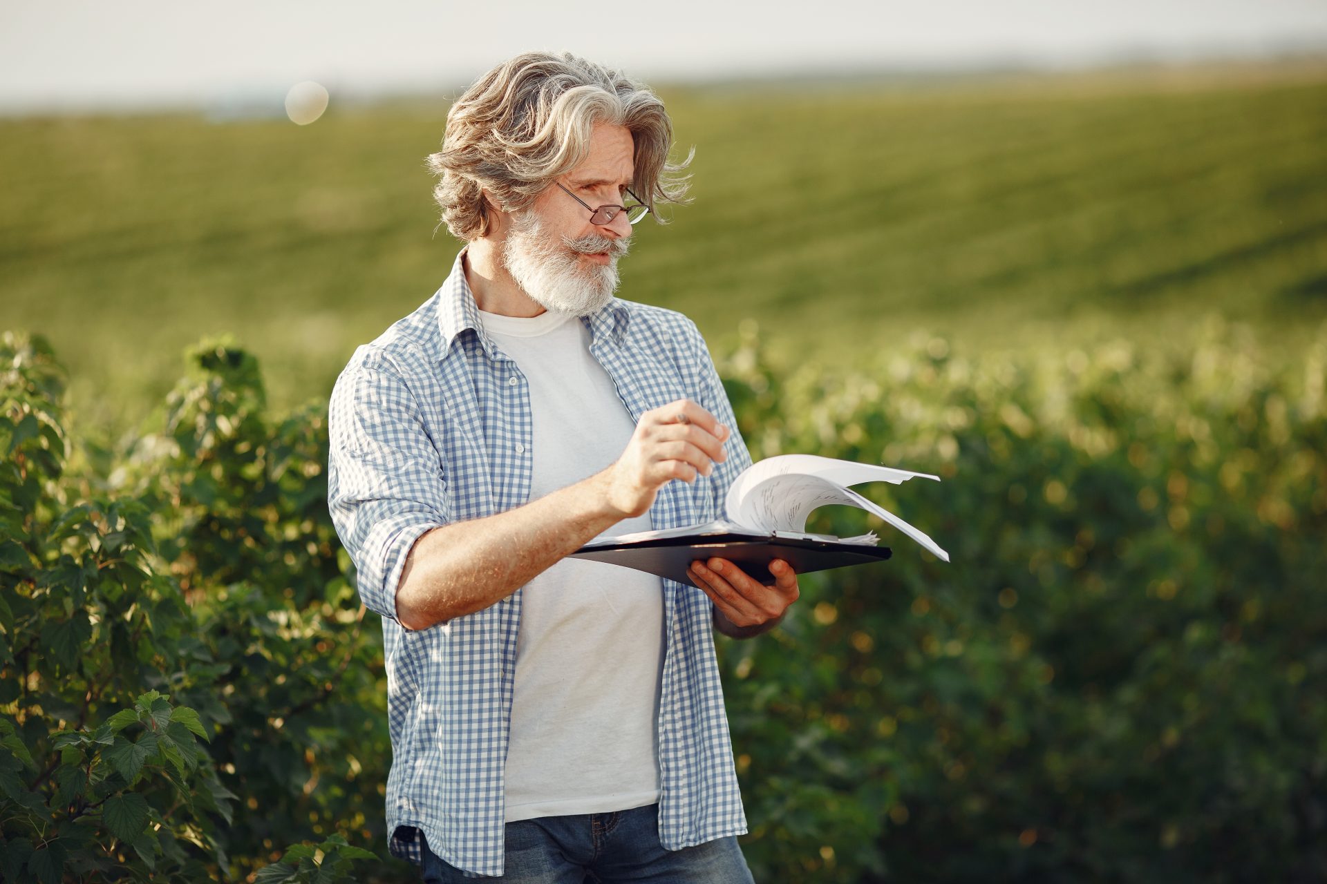 old farmer in shirt standing on field with noteboo 2021 08 29 09 41 12 utc