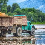 old truck transports cargo wade across the river 2021 08 26 16 23 51 utc