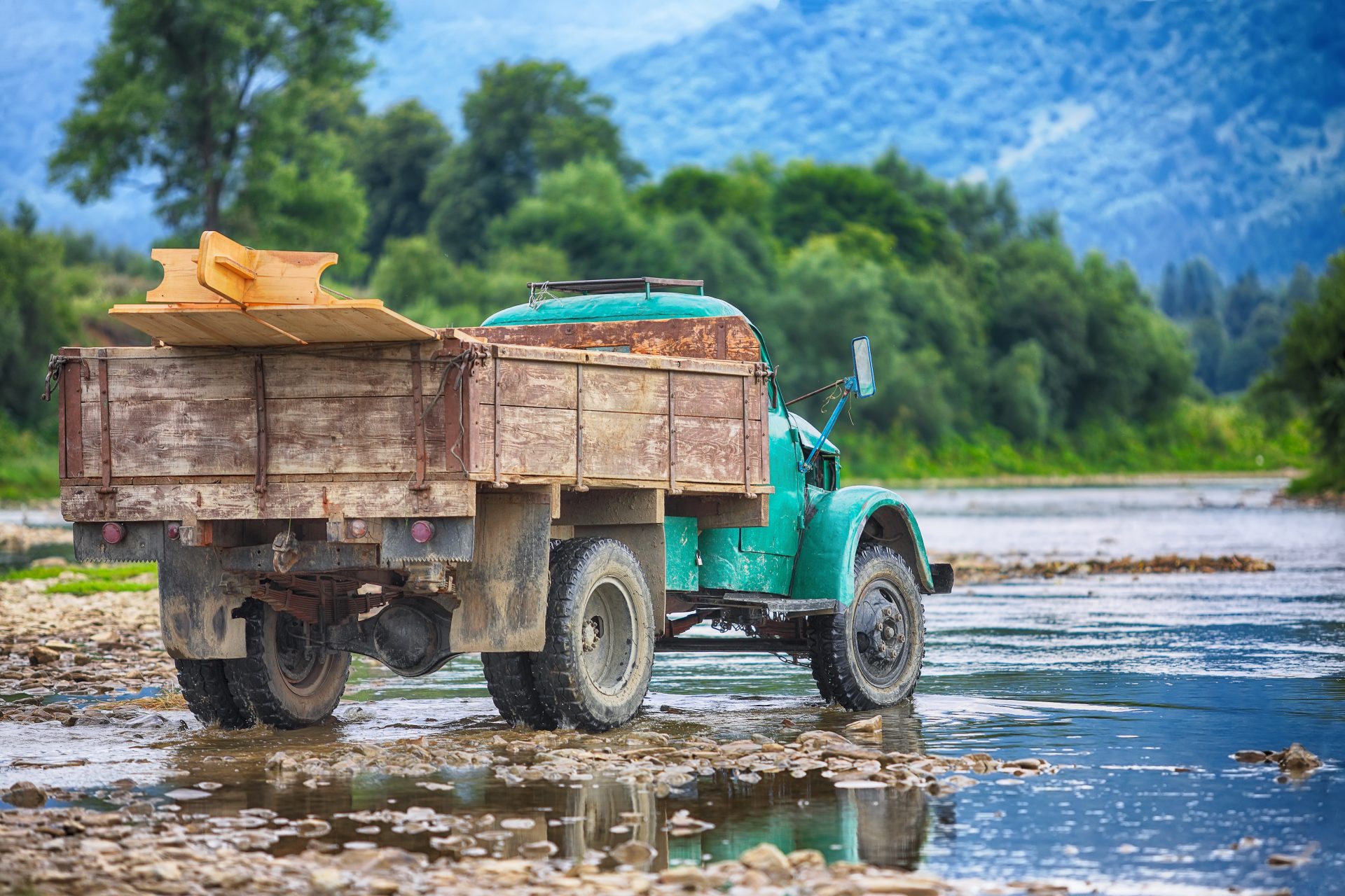 old truck transports cargo wade across the river 2021 08 26 16 23 51 utc