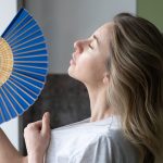 overheated woman in t shirt using wave fan suffer 2022 11 15 04 05 55 utc