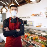 portrait of a young man shopkeeper standing by mea 2022 02 25 02 42 05 utc