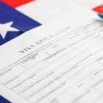 woman filling visa application form american flag 2022 10 18 16 56 21 utc
