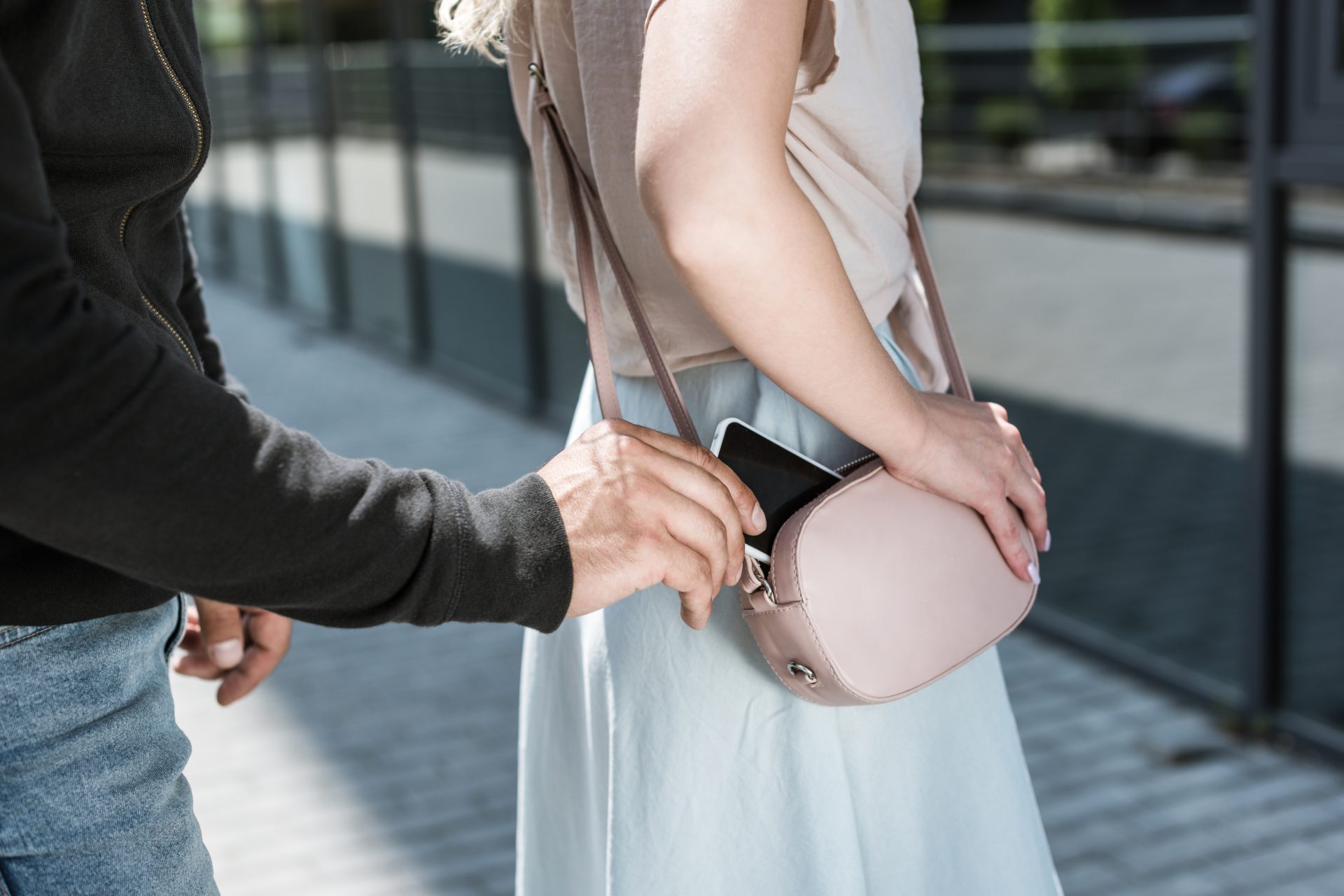 cropped view of criminal man pickpocketing smartph 2022 12 16 19 55 16 utc