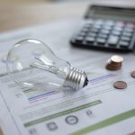 electricity bill with light bulb several coins and 2023 06 17 01 46 53 utc