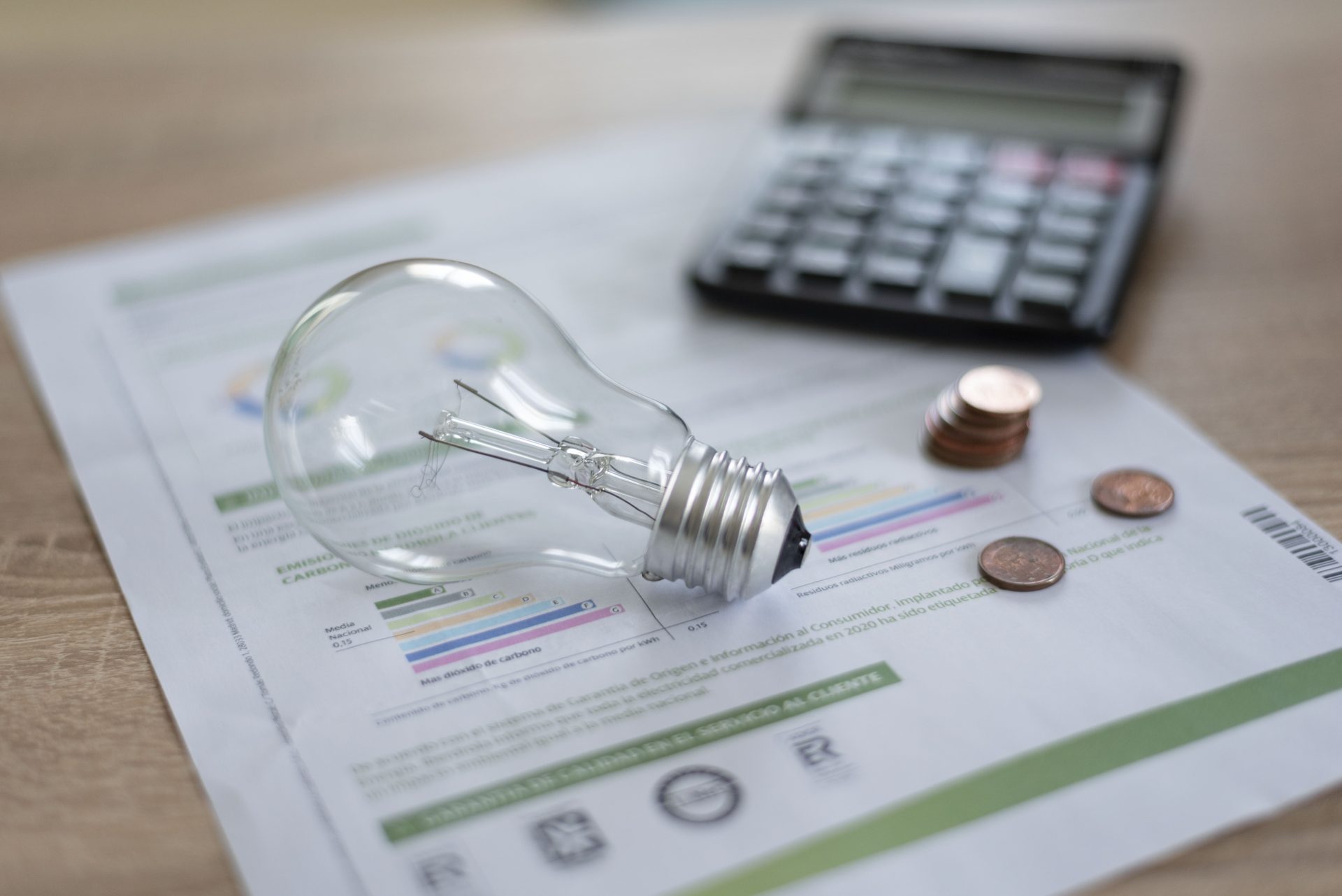 electricity bill with light bulb several coins and 2023 06 17 01 46 53 utc