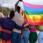 group of young people from behind holding the lgbt 2023 05 04 18 32 21 utc