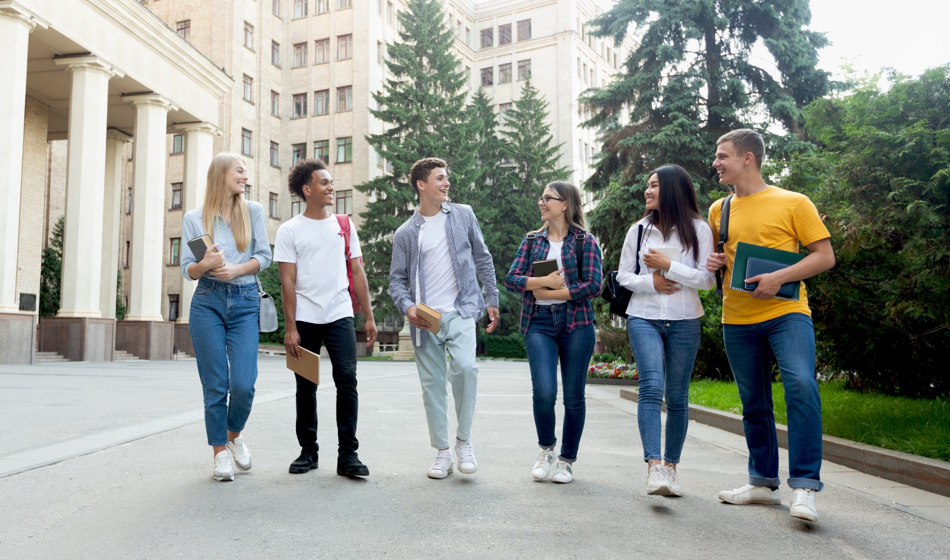 happy students walking outside the university buil 2022 12 16 07 04 42 utc