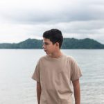 latino teenager looking in profile with khaki swe 2023 09 04 18 02 46 utc