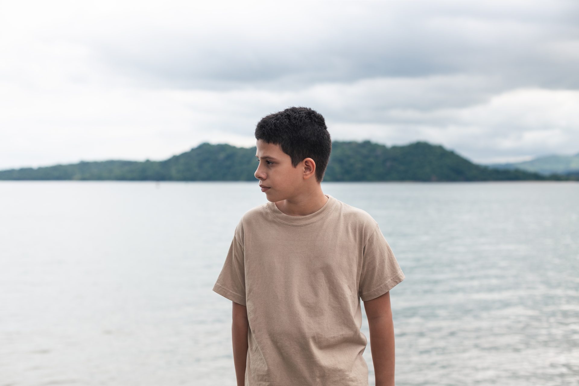 latino teenager looking in profile with khaki swe 2023 09 04 18 02 46 utc