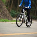 riding mountain bike climbing slope on road 2021 08 26 17 25 16 utc