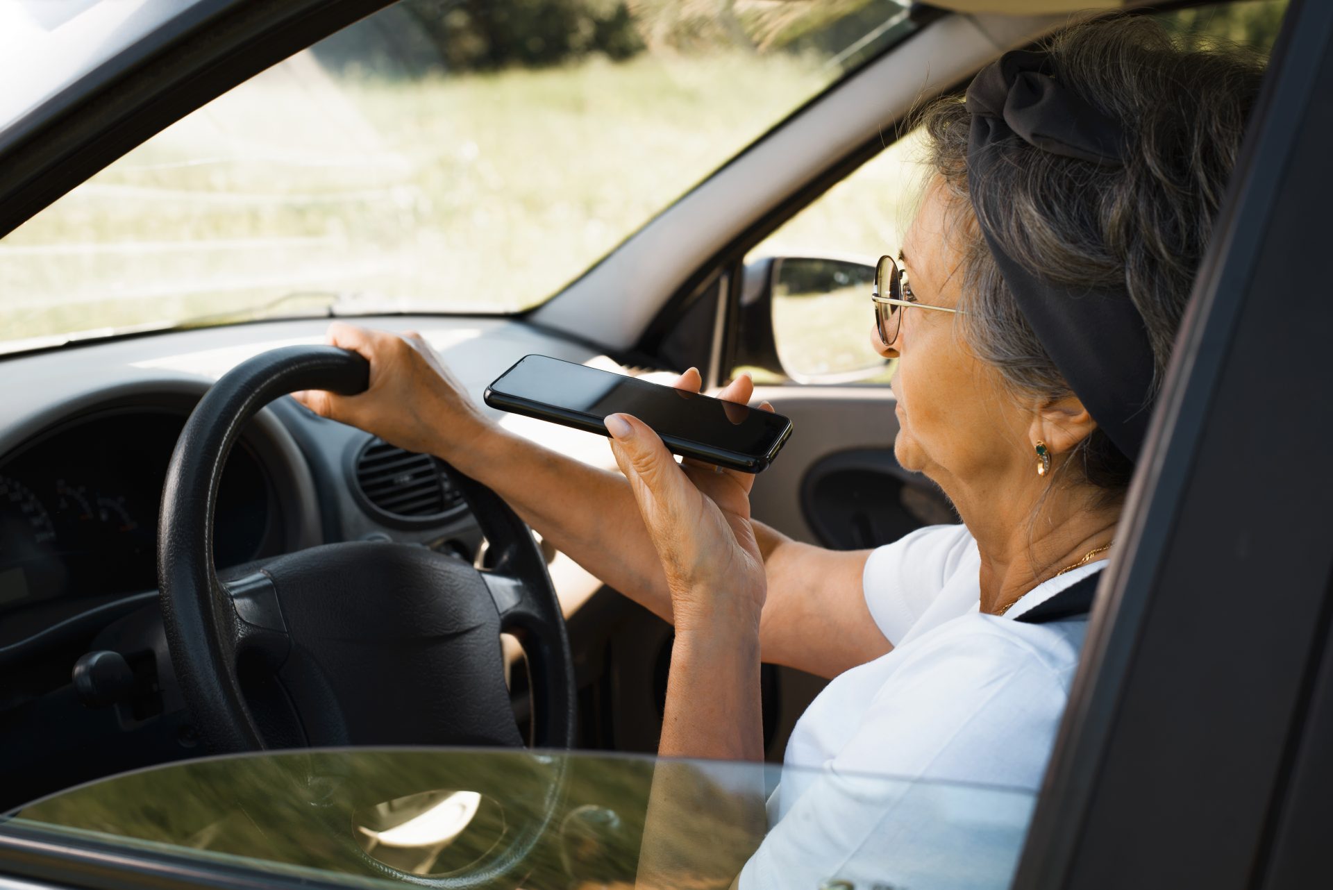senior woman with glasses talking on speakerphone 2022 05 23 23 59 34 utc