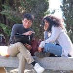 two latin students studying together sitting on a 2022 08 24 09 51 39 utc