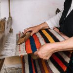 woman is woving a carpet at an authentic tradition 2022 11 16 00 54 39 utc