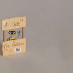 yellow toy robot manning ai chat stand 2023 04 21 21 37 23 utc