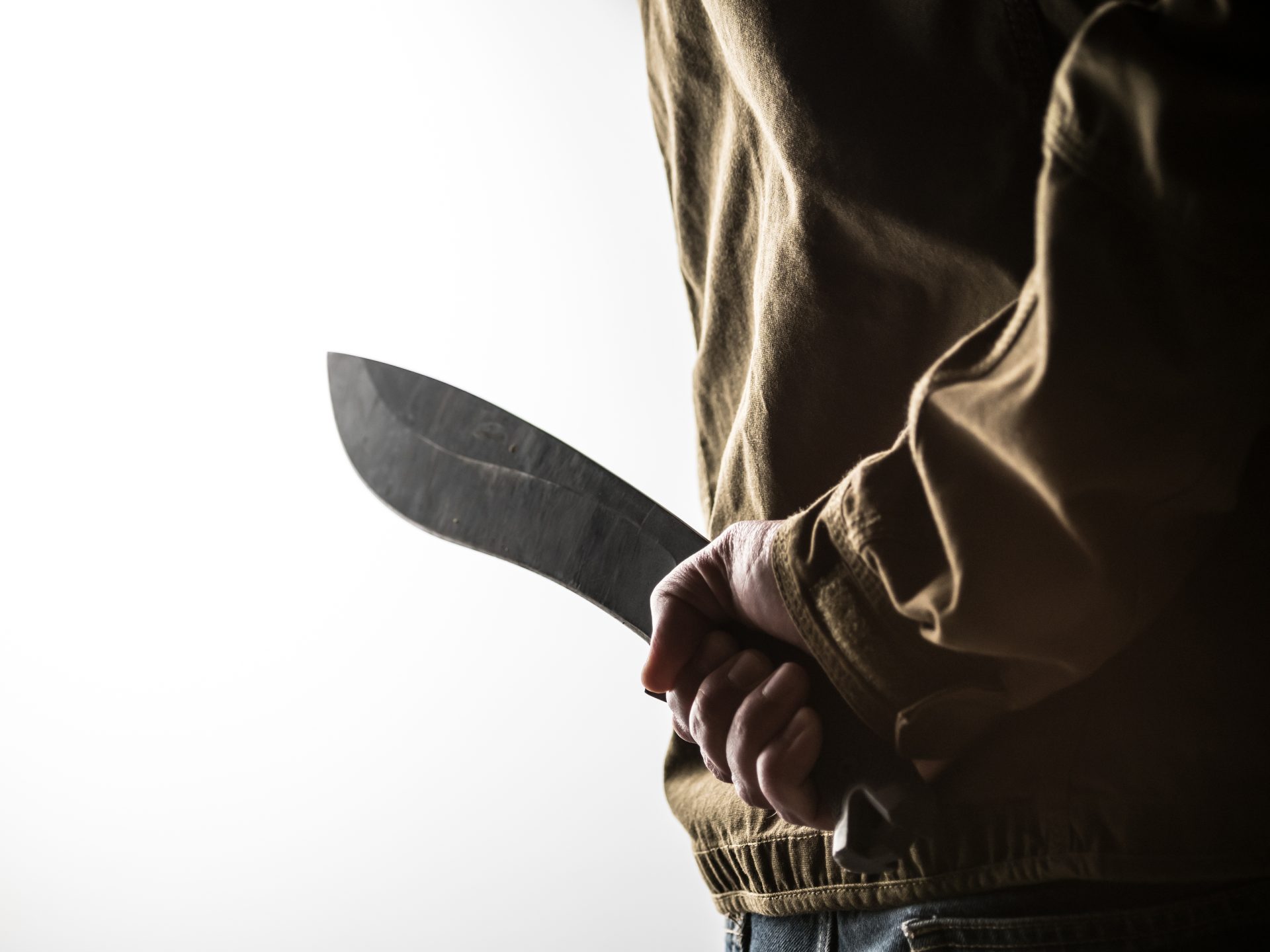 man holding a machete behind his back 2021 09 03 01 32 00 utc