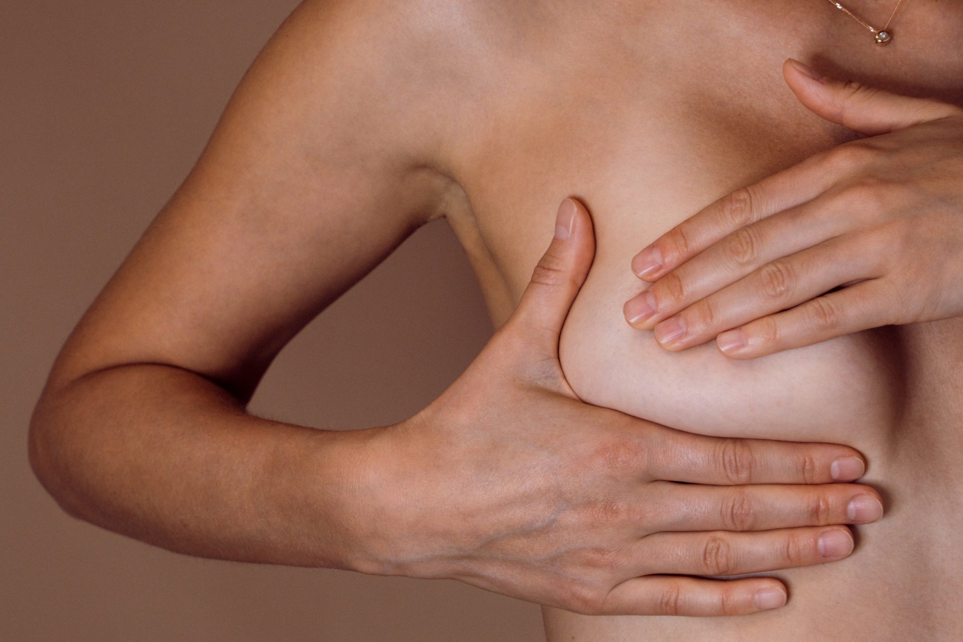 woman giving self breast exam 2022 11 15 18 03 19 utc