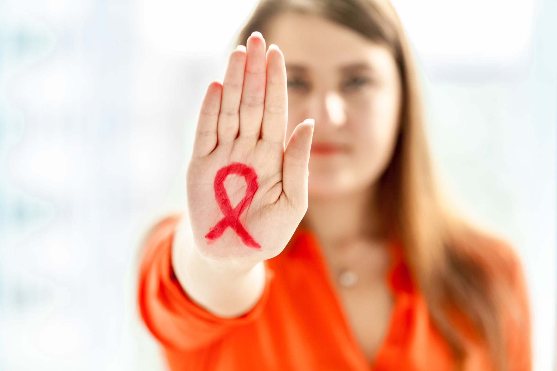 young woman showing hiv red loop drawn on hand 2021 12 14 18 47 29 utc